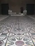 Dallage au centre de la Curie, opus sectile restauré.