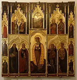 Retable peint et doré représentant plusieurs scènes religieuses.
