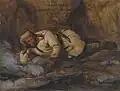 Lapon endormi près du feu.