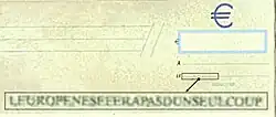 Image montrant un chèque de banque au fond jaune. Un encart montre un grossissement d'une partie de la ligne de saisie de la date, rendant lisible le texte « L'Europe ne se fera pas d'un seul coup ».