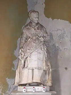Sculpture de la tombe de Caterina Campodonico, célèbre nocciolaia génoise, au cimetière Staglieno.