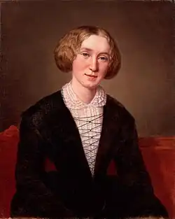 Peinture. Visage ovale avec cheveux roux coiffés en coques de chaque côté, robe noire à empiècement et col de dentelle blancs, regard sérieux, silhouette paraissant fragile