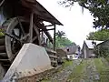 Bâtiment de la déceriseuse avec la roue à aubes
