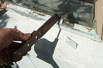 Couteau à démastiquer.