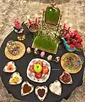 Une table de Haft-Sîn.