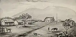 Dessin comportant neuf bâtiments. Huit maisons et une église de fortune au centre.