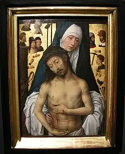 Tableau montrant la Vierge qui soutient le Christ mort, sur fond des instruments qui ont conduit à la mort, peints sur fond d'or.