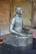 Le Batteur, en bronze, à l'extérieur de PUB à Stockholm