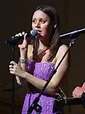 Hillary Lindsey singing onstage.