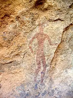 Peinture rupestre dans le Hoggar, représentant un homme.