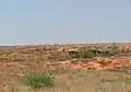 Baraques des mineurs à Ilakaka et paysage déformé