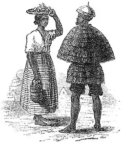 Illustration d'un homme et d'une femme Ilocano. L'homme porte un kattukong. v.1820