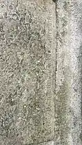Inscription sur une dalle funéraire (détail).