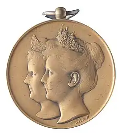 Draagteken ter herdenking van het regentschap van koningin Emma en de inhuldiging van koningin Wilhelmina