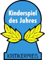 Logo du Kinderspiel des Jahres présent sur les boites de jeu.