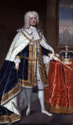 Portrait en pied d’un homme portant perruque et manteau d’hermine.