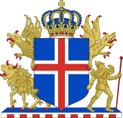 Vue d'un écu aux couleurs bleu, rouge et blanche surmontée d'une couronne, entouré en haut par deux dragons, en bas par un bélier et un homme