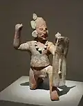 Guerrier au visage scarifié.