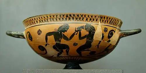 Coupe comaste attique à figures noires, vers -560.