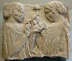 Selon la théorie enthéogène des religions, le bas-relief L'exaltation de la fleur&nbsp;(en) représente Déméter et Perséphone tenant en main des champignons