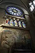 Le portail du transept gauche en entrant, peinture et vitraux.
