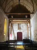 Narthex, avec la charpente du nouveau soubassement du clocher.