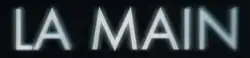 Description de l'image La Main (film, 2022).png.