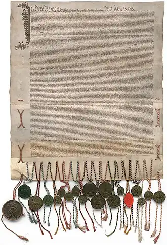 Charte manuscrite sur 2 pièces de parchemin cousues ensemble et portant des sceaux en cire