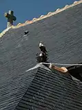 Épis de faîtage sur la toiture de l'église Saint-Laurent.