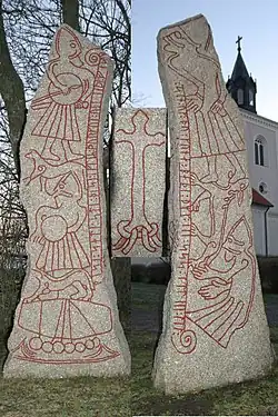 Odin englouti par Fenrir sur la pierre runique de Ledberg.