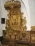 Le retable des fonts baptismaux.