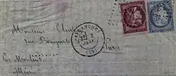 Photographie en couleur d'une lettre, deux timbres sont apposés, un rouge, l'autre bleu.