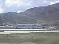 L'aérogare vue depuis la piste (sans date).