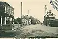 Liffré ː une partie de la rue principale vers 1925 (carte postale).
