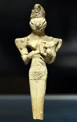 Femme nue à tête de lézard allaitant un enfant, Ur, Irak, environ 4000 BC, Musée national d'Irak.