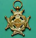 Médaille du mérite scolaire ou croix d'honneur, vers 1900, surtout utilisée dans l'enseignement confessionnel.