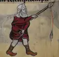 Une femme tenant un fuseau et une quenouille en train de se gratter. Drôlerie marginale d'un manuscrit du premier quart du XIVe s. (British Library Stowe MS17, fol. 64v).