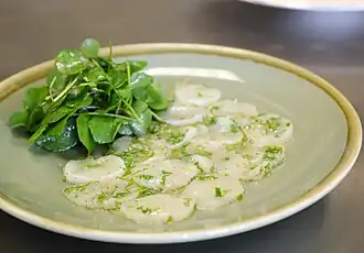 En carpaccio.