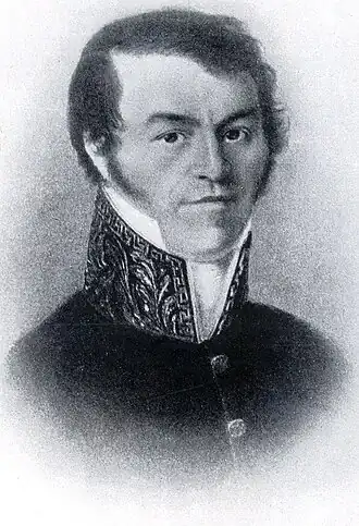 Portrait en noir et blanc d'une jeune homme regardant le lecteur