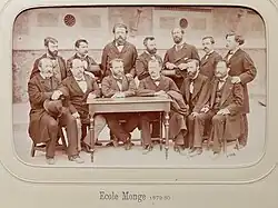 1879, les enseignants et le directeur Aimé Godard (à la table à droite).