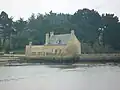 Le moulin et sa digue.
