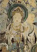 Guanyin entourée d'autres bodhisattvas, en bas un roi céleste (?). Début Tang (7e&nbsp;s)Grotte  N° 57, mur sud