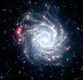 NGC 3938 en infrarouge Spitzer par K. Gordon du STSci eet de l'équipe SINGS.