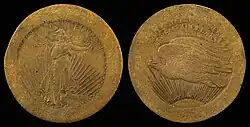 Deux faces d'une pièce de monnaie. L'une avec une femme portant un flambeau dans sa main droite et un rameeau dans la gauche et l'autre avec un aigle volant vers la gauche.