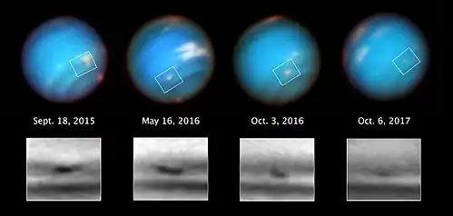 Quatre images à un an d'écart de la même zone de la planète montrant qu'une tache diminue de taille.