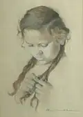 Fillette se nouant des tresses