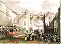 Tranchée ferroviaire envahie par la foule et dans laquelle circule un train de voyageurs, et surplombée d'une arche