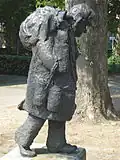 Oss, statue le marchand ambulant.