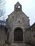 Arc triomphal transformé en mur-pignon du chœur. À gauche, on voit les premières marches de l'escalier qui montait aux combles.