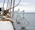 Pêche au carrelet sur une jetée de Nieuport.